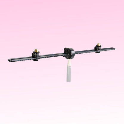 Angled front view of Grace Design SB-66 25.98" Spacebar Stereo Microphone Mounting Kit on pink background