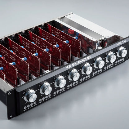 Angled view of Grace Design m801mk2 8-Channel Microphone Preamp with top removed on grey surface