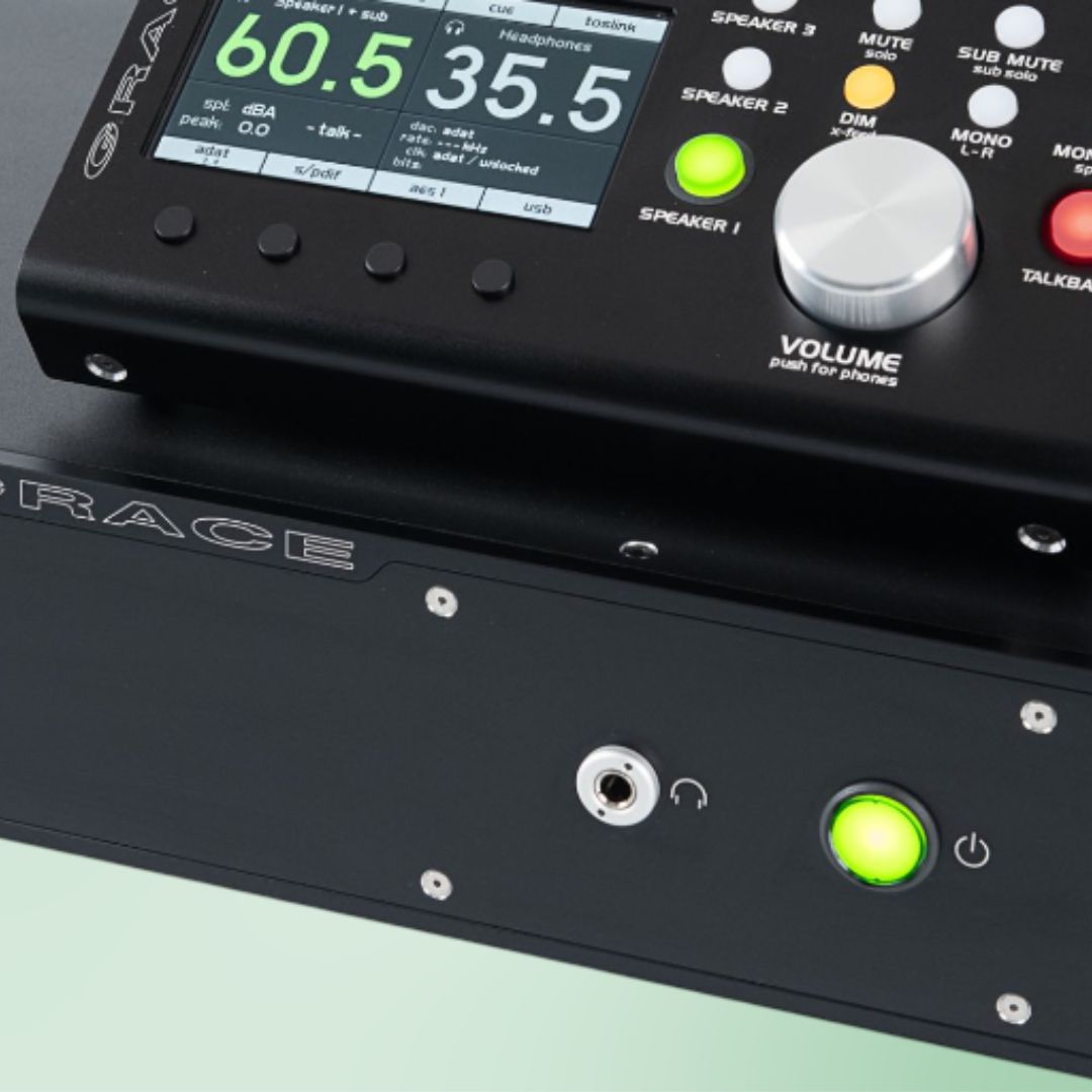 Close up view of Grace Design m905 Reference Stereo Monitor Controller on green background