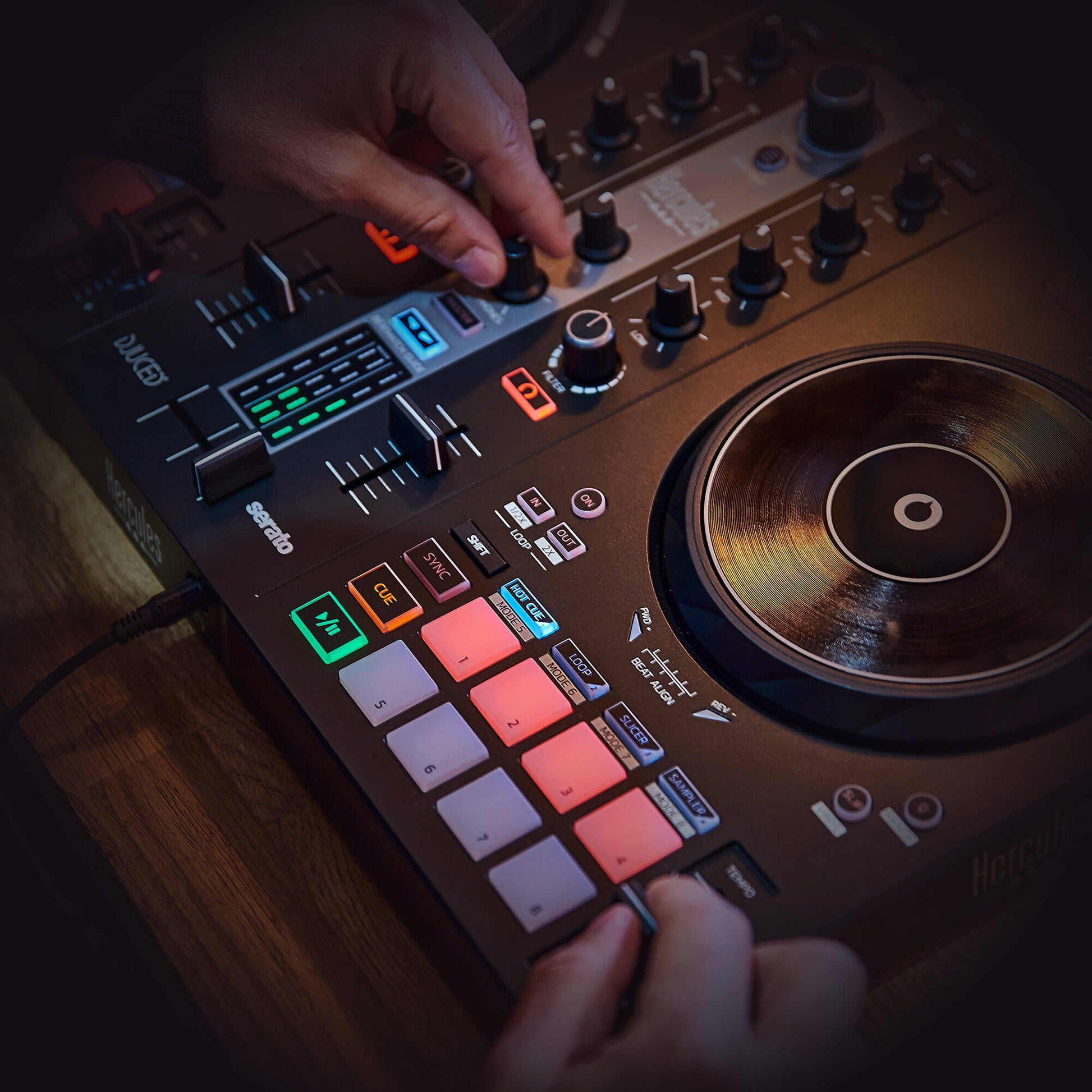 DJ playing the Hercules DJControl Inpulse 300 MK2 DJ Controller inside club