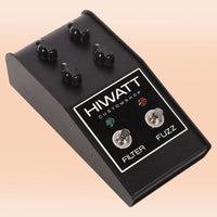 Angled view of Hiwatt Custom Filter Fuzz Pedal on orange background