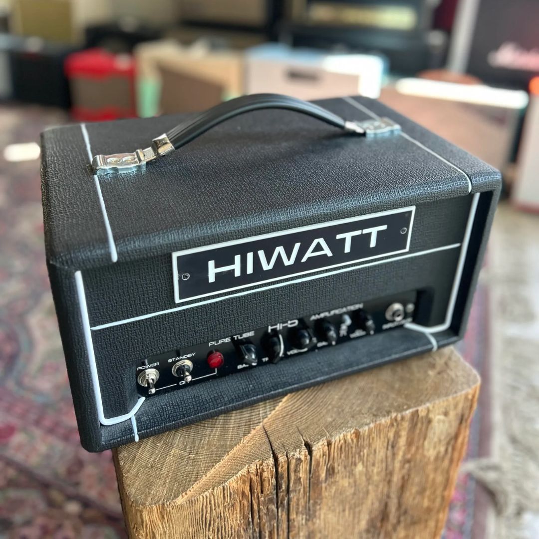 Angled front view of Hiwatt Hi-5 Guitar Amplifier Head on log table in studio