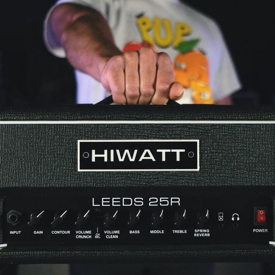 Close up front view of Hiwatt Leeds 25R Guitar Amplifier Head with person holding it up in studio