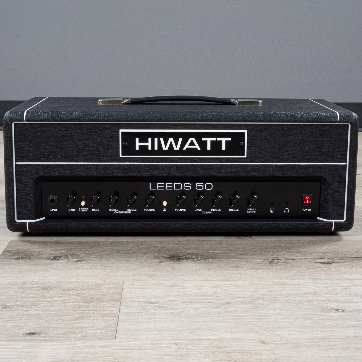 Front view of Hiwatt Leeds 50R Head on wooden surface with grey background