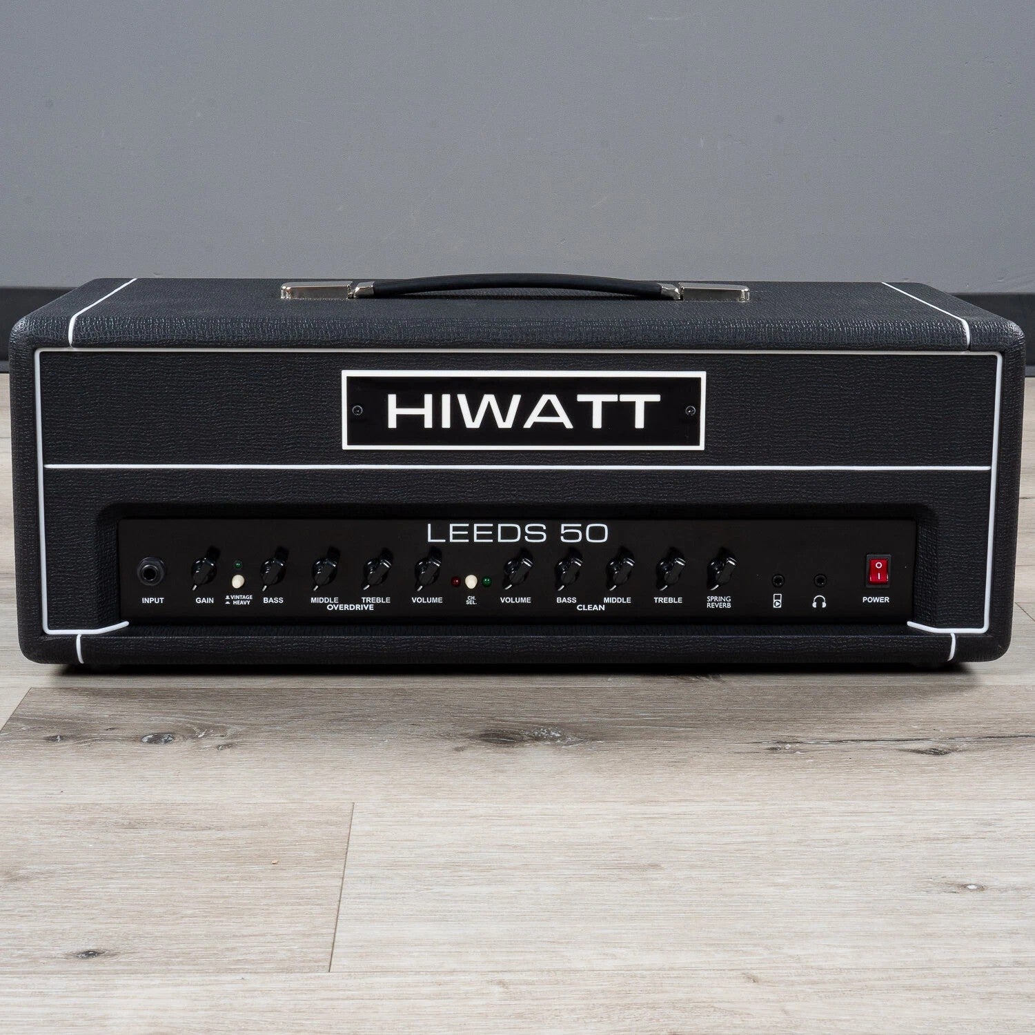 Front view of Hiwatt Leeds 50R Head on wooden surface with grey background