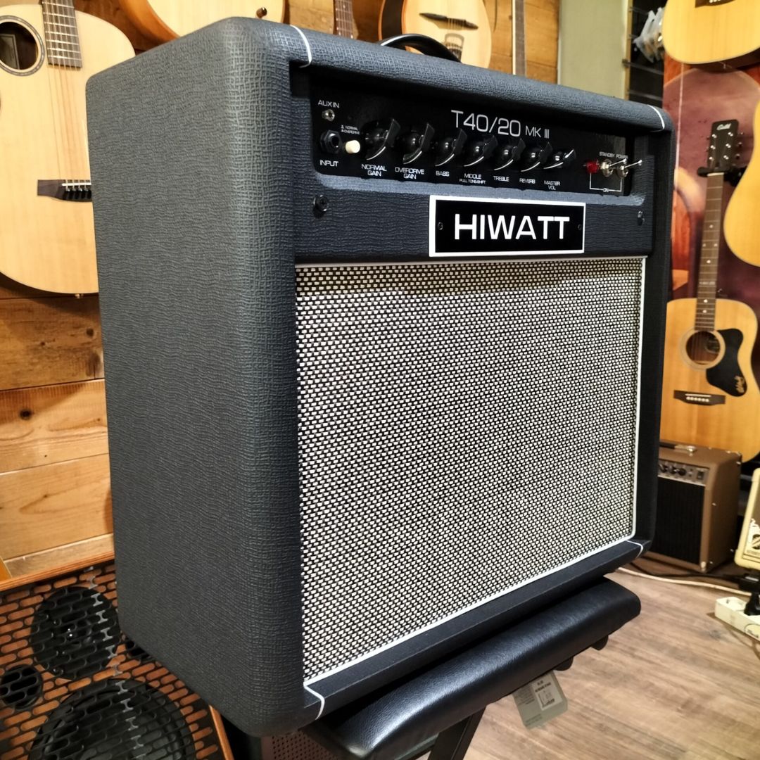 Angled view of Hiwatt T40/20 Combo 1x12 Guitar Amplifier on top of stool with guitars in the background