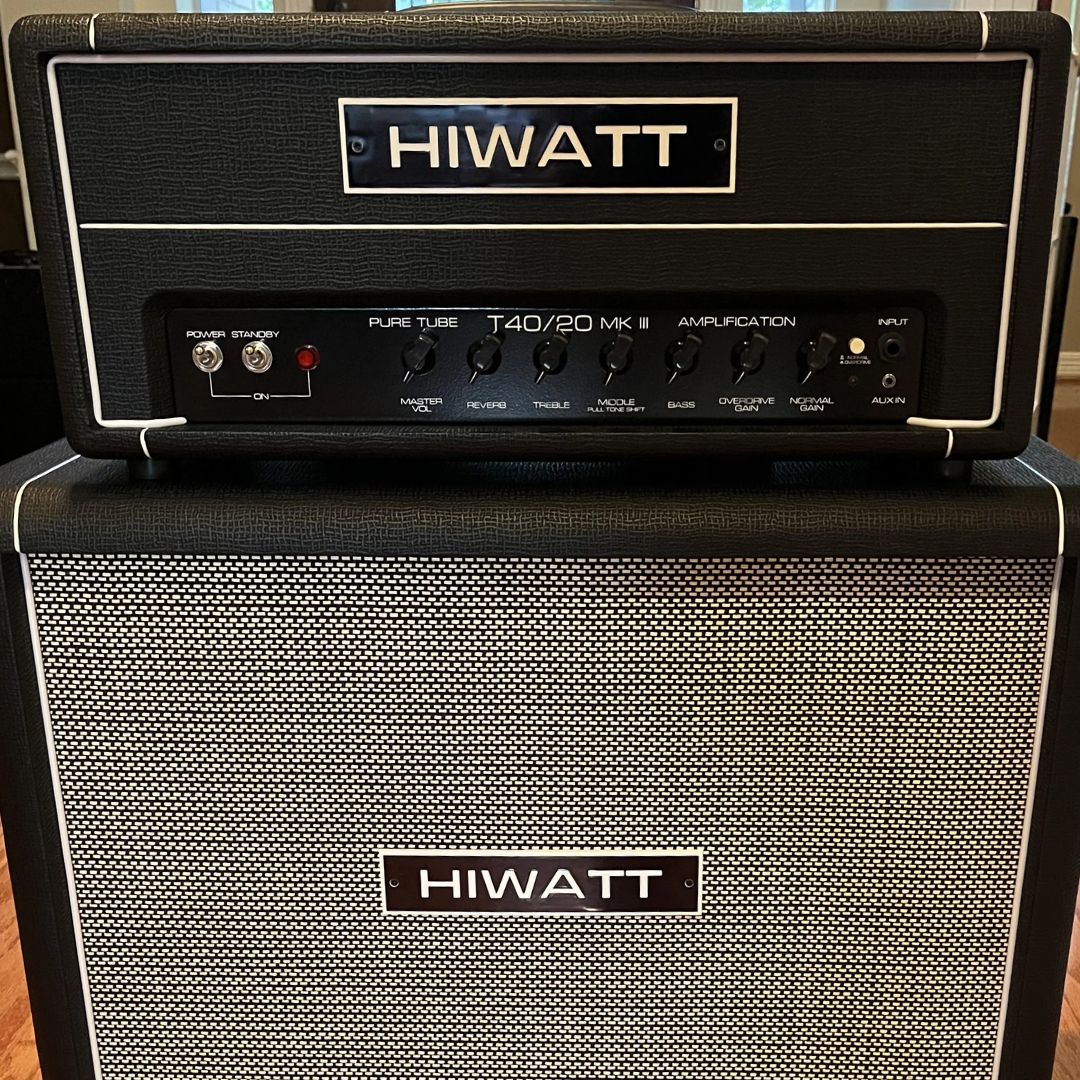 Close up front view of Hiwatt T40/20 Guitar Amplifier Head on top of speaker cab in studio