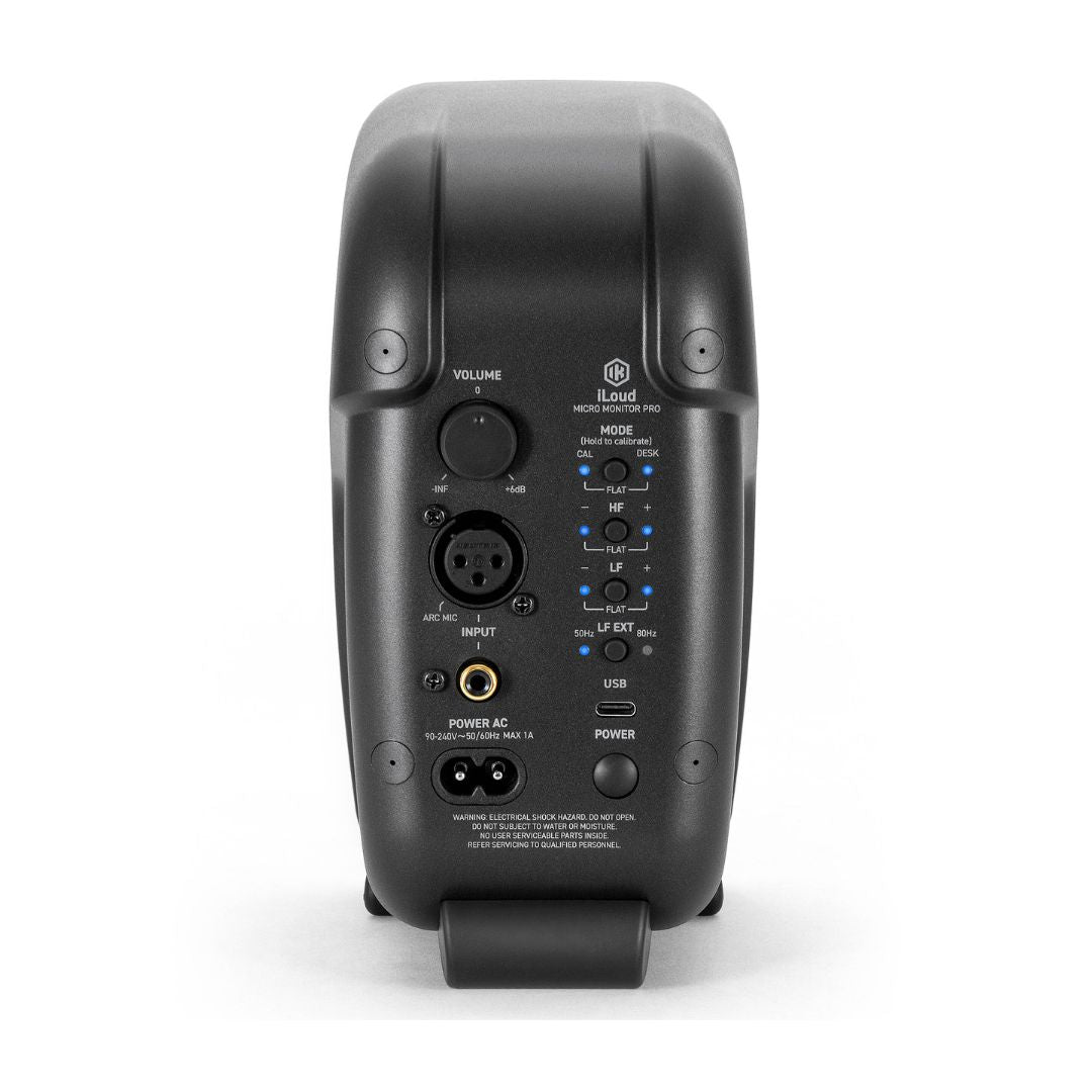 Back view of a black audio equipment unit with control buttons and ports on a white background