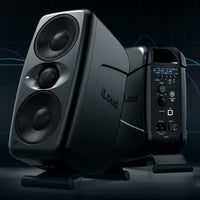 iLoud monitor speakers with control panel on a dark background