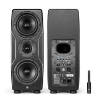 Pair of IK Multimedia iLoud Precision MTM MKII side by side displaying front and rear panels with ARC microphone on white background