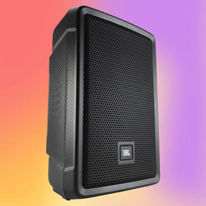 Angled view of JBL IRX108BT Powered 8” Portable Speaker with Bluetooth on multicolored background