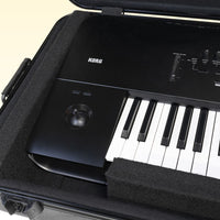 Close up view of Korg HC-76 opened lid with keyboard inside on yellow background