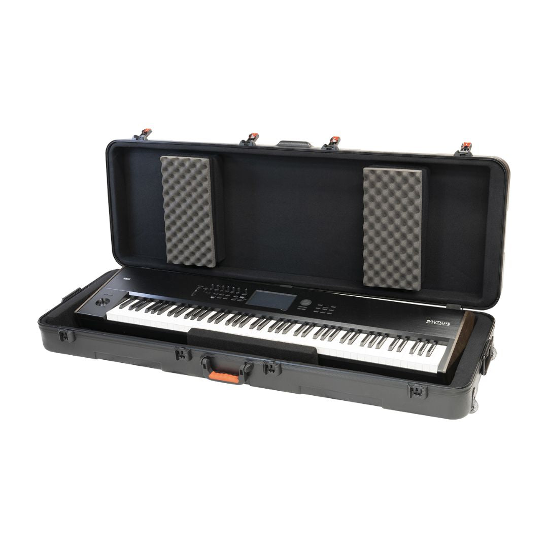 Open lid view of Korg HC-88 with keyboard in case on white background