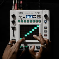 Hands playing with the Korg KAOSS Pad V Dynamic Effect / Sampler on dark desk