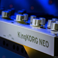 Close up rear view of Korg KingKORG NEO Synthesizer on blue background