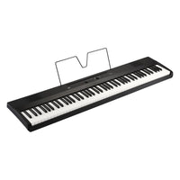Angled view of Korg Liano with music stand on white background