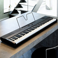 Angled view of Korg Liano on marble surface in living room