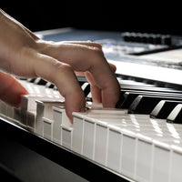 Close up view of hand playing the Korg NAUTILUS AT 
