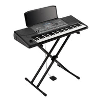 Angled front view of Korg Pa600 on stand on white background