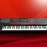 Front view of Korg Pa700 on red background