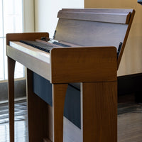 Angled side view of Korg Poetry Digital Piano in living room