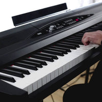 Close up view of Korg SP-280 Digital Piano being played in studio