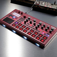 Angled view of Korg electribe sampler on grey surface with other samplers in the background