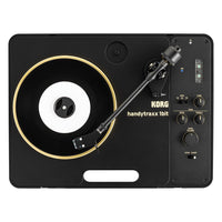 Top view of Korg handytraxx 1bit with vinyl on white background