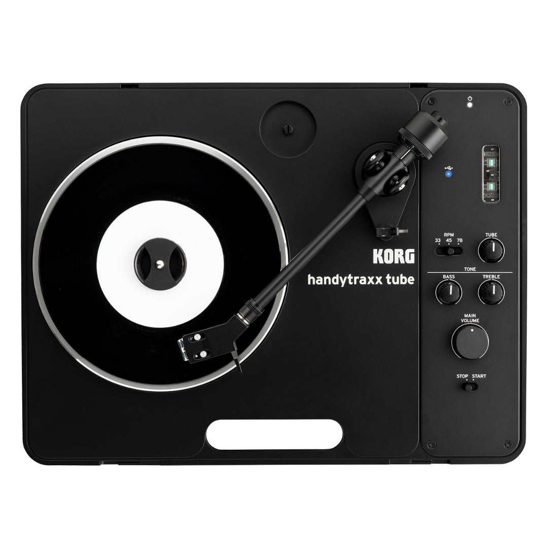 Top view of Korg handytraxx tube with vinyl on white background