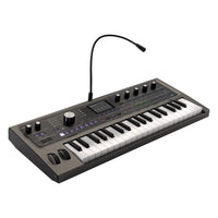 Angled front view of Korg microKORG2 with vocoder mic attached on white background