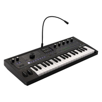 Angled front view of Korg microKORG2 Black with vocoder mic attached on white background