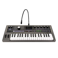 Front view of Korg microKORG2 with vocoder mic attached on white background