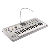 Angled front view of Korg microKORG2 White with vocoder mic attached on white background