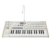 Angled front view of Korg microKORG S with vocoder mic on white background