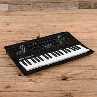 Angled front view of Korg minilogue xd Polyphonic Analogue Synthesizer on wooden surface