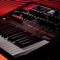 Angled close up view of Korg modwave mk II Wavetable Synthesizer on red wavy background