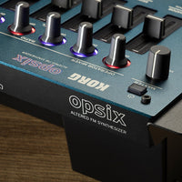 Close up rear view of Korg opsix module on wooden surface