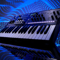 Angled close up view of Korg wavestate mk II Wave Sequencing Synthesizer with blue wave background