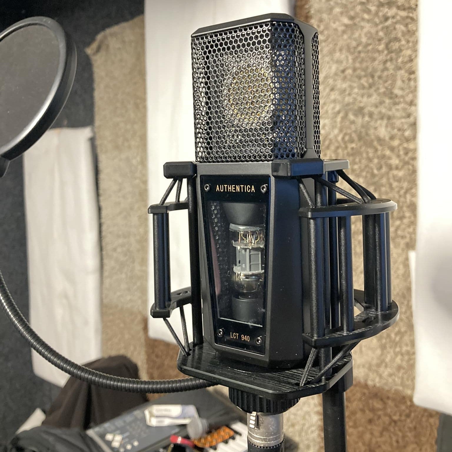 Angled view of Lewitt Audio LCT 940 Tube and FET Microphone mounted on stand in studio