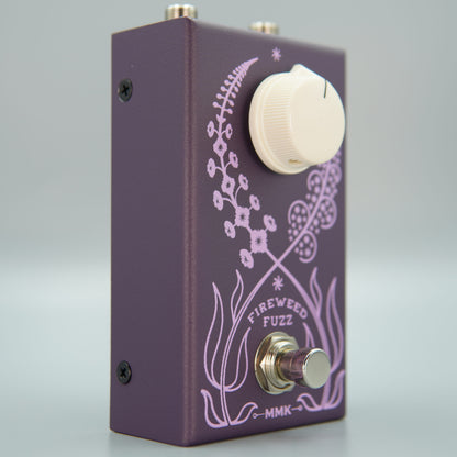 Angled front view of MMK Electrics Fireweed Fuzz Pedal on grey background