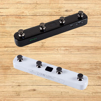 Slanted black Mooer F4 on top of slanted white Mooer F4 with wooden background