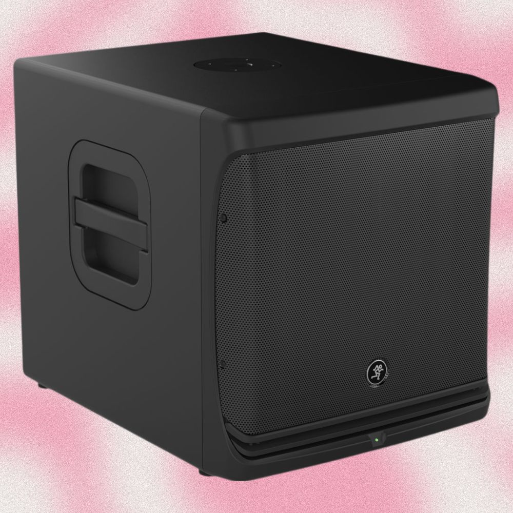 Angled view of Mackie DLM12S 12" 2000W Powered Loudspeaker on pink background