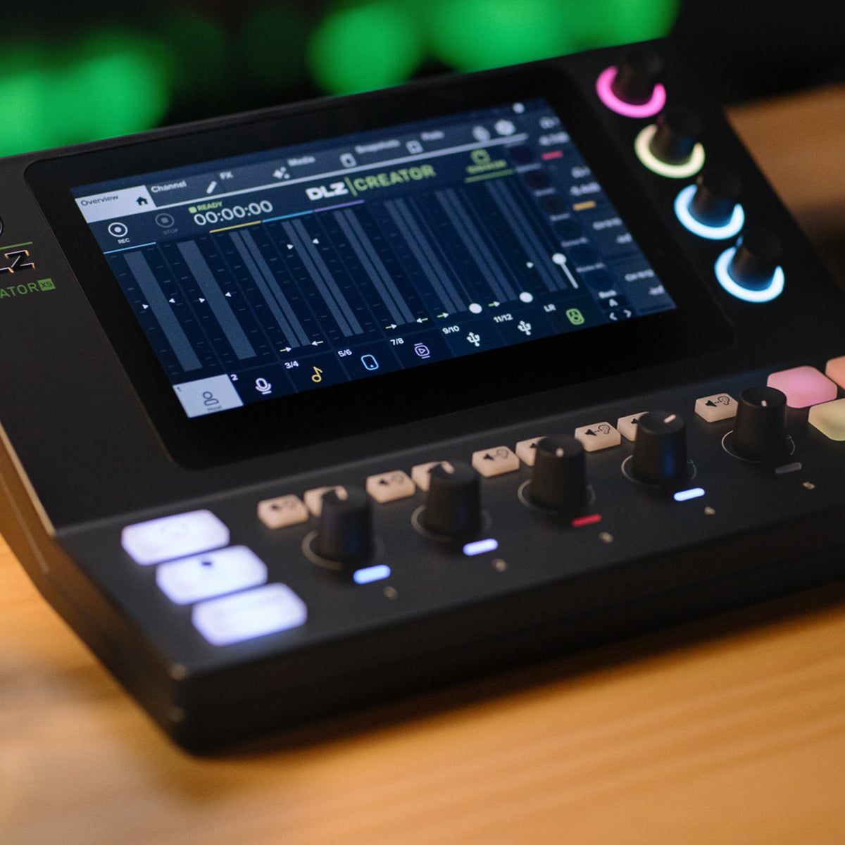 Close up angled view of Mackie DLZ Creator XS Adaptive Digital Streaming Mixer on wooden surface