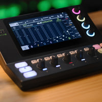 Close up angled view of Mackie DLZ Creator XS Adaptive Digital Streaming Mixer on wooden surface