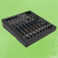Angled view of Mackie ProFX10 GO Battery-Powered Mixer on green background