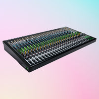 Angled view of Mackie ProFX30v3 30-Channel Professional USB Mixer on pink and blue gradient background