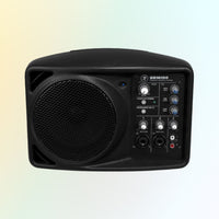 Black speaker with control panel on a gradient background