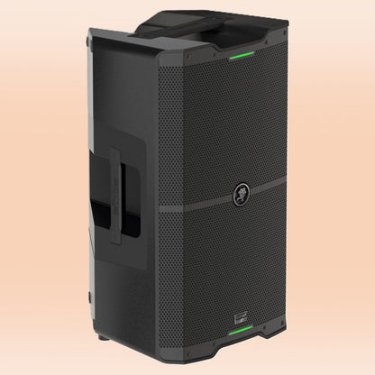 Angled view of Mackie SRM212 V-Class 12" 2000W High-Performance Powered Loudspeaker on orange background