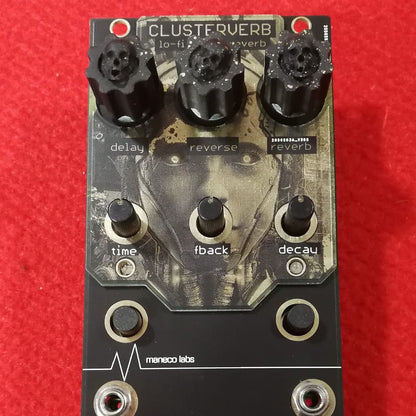 Close up front view of Maneco Labs Clusterverb Module Knobs on red background