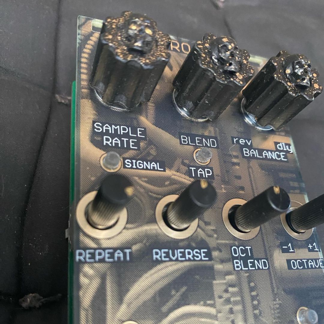 Close up view of Maneco Labs Cuatro A De 4AD Module on black couch